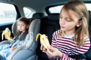 Kids eating in a car